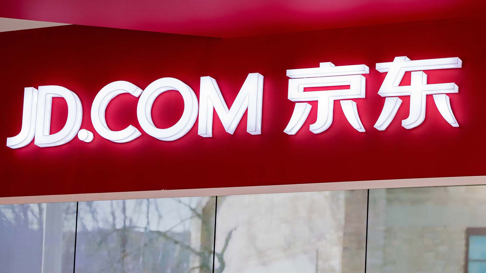 the JD.com (JD stock) logo on the outside of a building