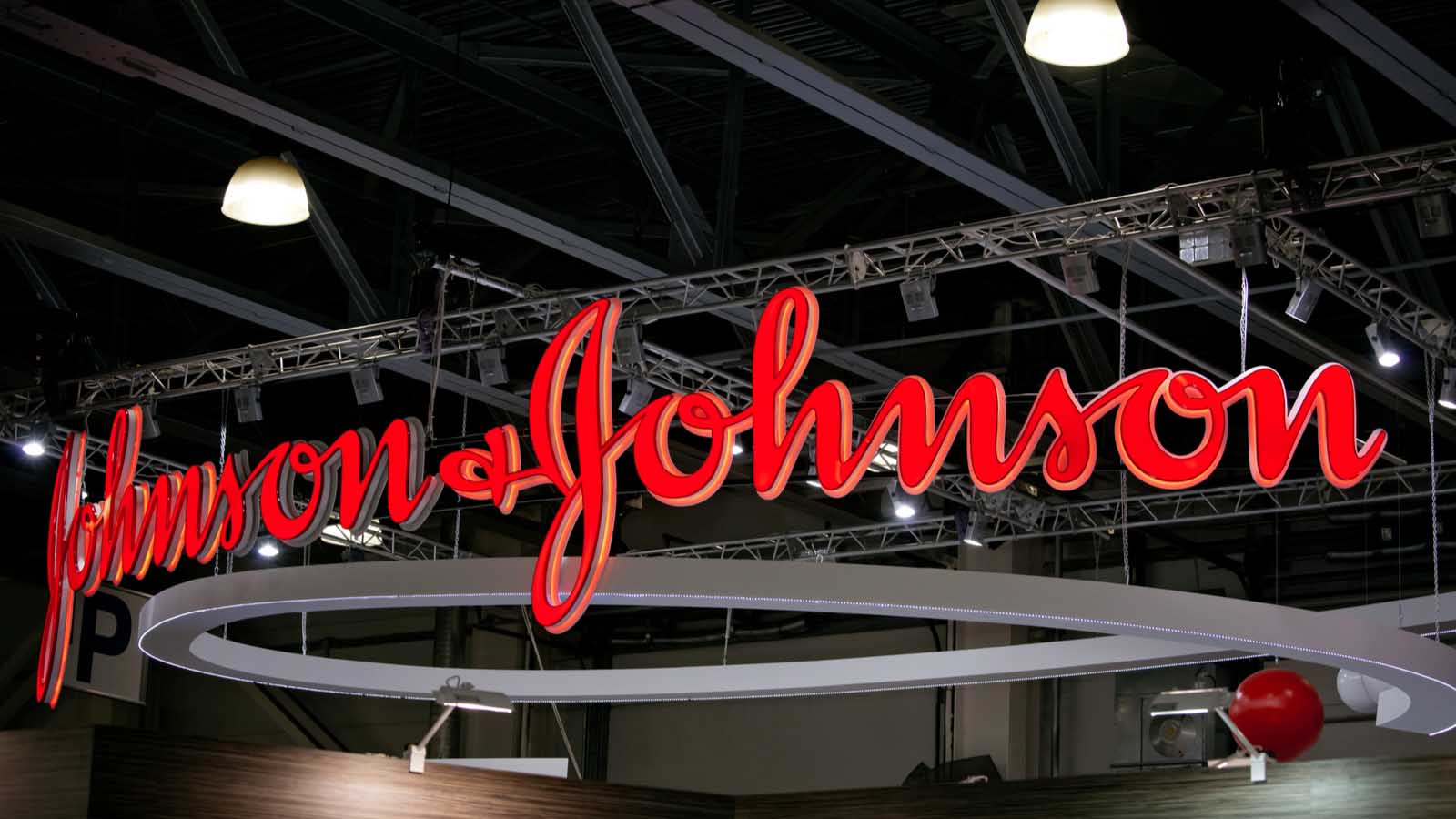 A red Johnson & Johnson (JNJ stock) sign hangs inside in Moscow, Russia.