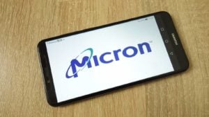 Micron (MU) logo on a mobile phone that's on a table