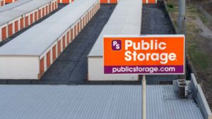a Public Storage sign in front of a facility of storage buildings