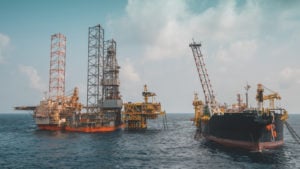 oil rigs on water, representing high-risk stocks like RIG