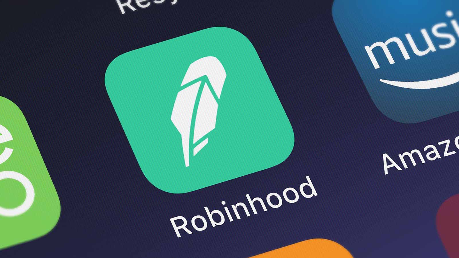 Robinhood mobile app logo is displayed on a smartphone screen hood stock