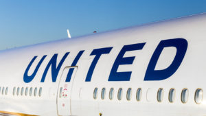 Image of the United logo on the side of a plane representing UAL stock.