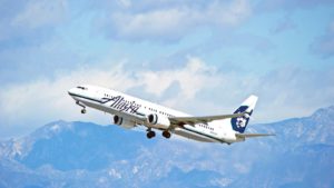 Alaska Airlines (ALK) aircraft is airborne as it departs Los Angeles International Airport