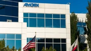 the Amgen (AMGN) logo on a building during daylight. weight-loss drug stocks