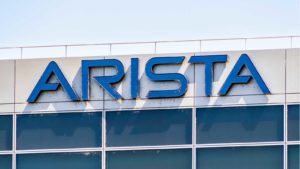 The Arista Networks (ANET) logo on the side of a building.