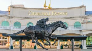 Entrance to the Churchill Downs (CHDN) venue featuring a statue of the 2006 Kentucky Derby champion Barbaro.