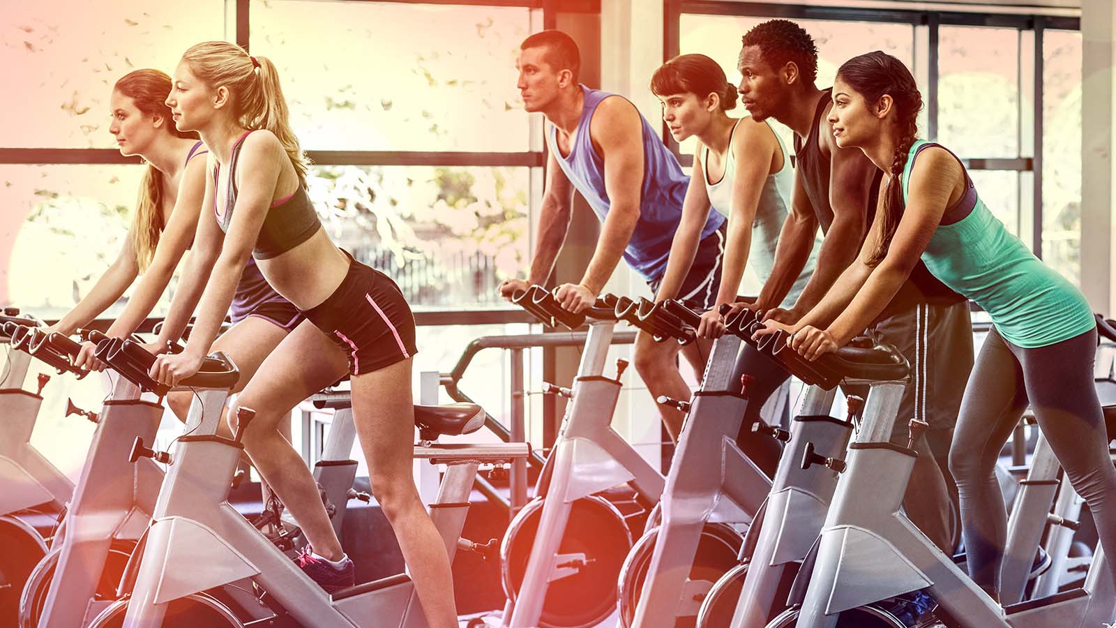 a fitness class working out representing fitness stocks to buy
