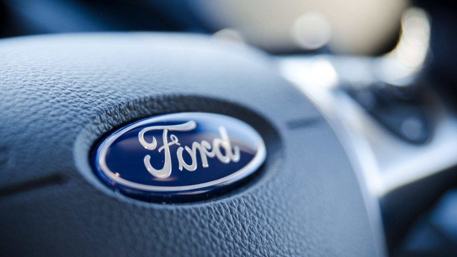 Ford logo on a steering wheel. F stock