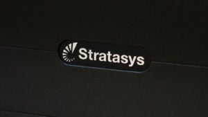 Stratasys (SSYS) logo on black background