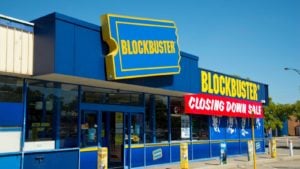 An outside view of a Blocbuster storefront closing down