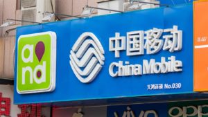 A banner outside a China Mobile (CHL) store in Beijing, China.