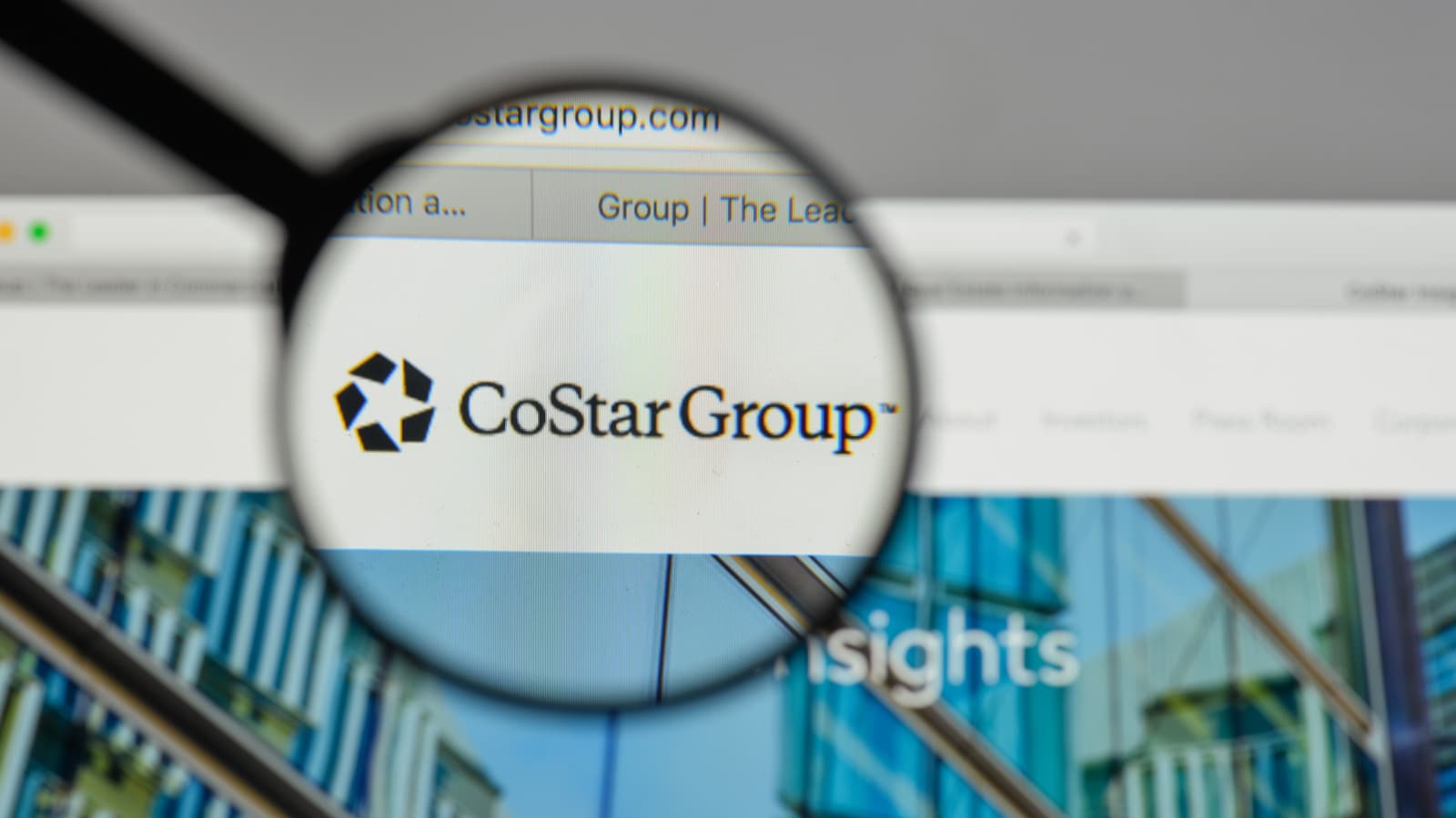 An image of a magnifying glass zooming in on the CoStar Group, Inc. (CSGP Stock) logo