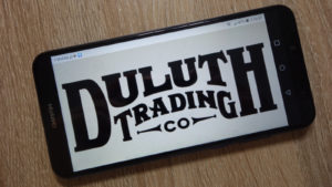 a smartphone with the Duluth Trading Co logo displayed onscreen