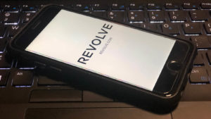 Revolve (RVLV) logo on an iphone
