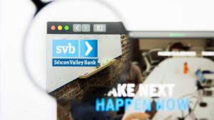 a magnifying glass enlarges the Silicon Valley Bank logo on a website
