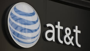 Image of AT&T (T) logo on a gray storefront
