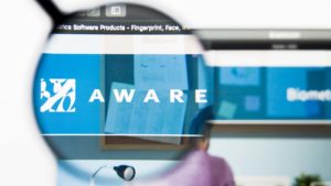 Aware (AWRE) logo displayed on a web browser and enlarged by a magnifying glass