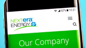 Nextra Energy (NEE) website on a mobile phone screen representing renewable energy stocks