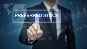 visualization of a man in a business suit pressing on the words "preferred stock"