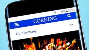 the corning (GLW) logo and homepage displayed on a mobile phone