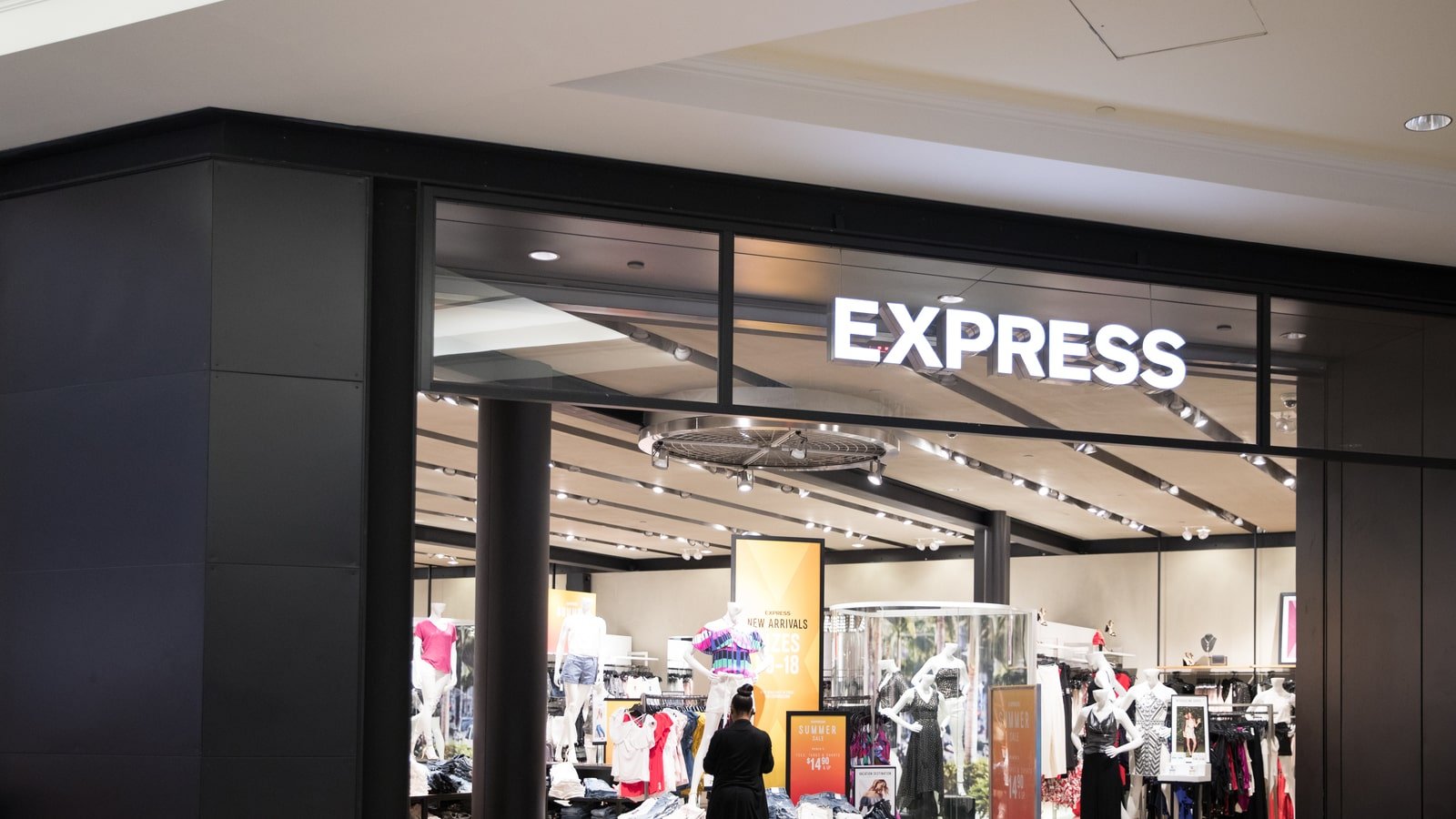 the storefront of an Express store in a mall representing EXPR stock.