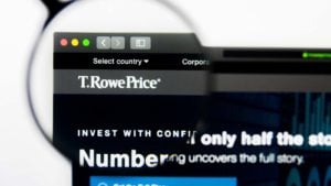 T row price (TROW) logo magnified through a lens while displayed on a web browser