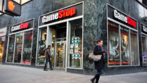 GameStop (GME) Store at a street corner with people walking past it