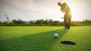 a man golfing on a golf course