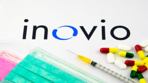 the inovio (INO) logo covered up by pills and a syringe