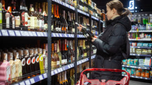 a woman shopping in a liquor store