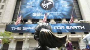 Virgin Galactic (SPCE) billboard on the New York Stock Exchange, across from the Fearless Girl statue.