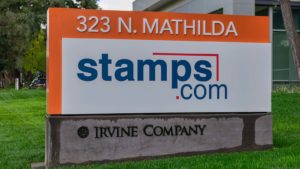 the stamps.com (STMP) logo on a sign outside of a corporate building