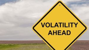 a yellow warning sign that says "volatility ahead"