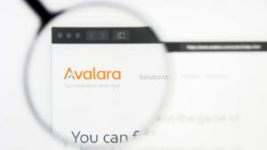 avalara (AVLR) logo on a web browser enlarged by a magnifying glass