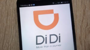 DiDi logo on smartphone representing the company stock.