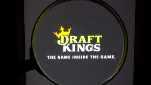 DraftKings (DKNG) logo, magnified, on its app. insider buying