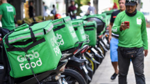 A photo of Grab Food Bags on the back of motorcycles