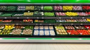 Fresh fruits and vegetables on the shelf in the supermarket. retail stocks