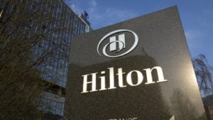 the sign in front of a Hilton (HLT) hotel. bill ackman stocks