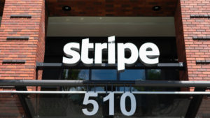 A sign for Stripe displayed outside a corporate office.