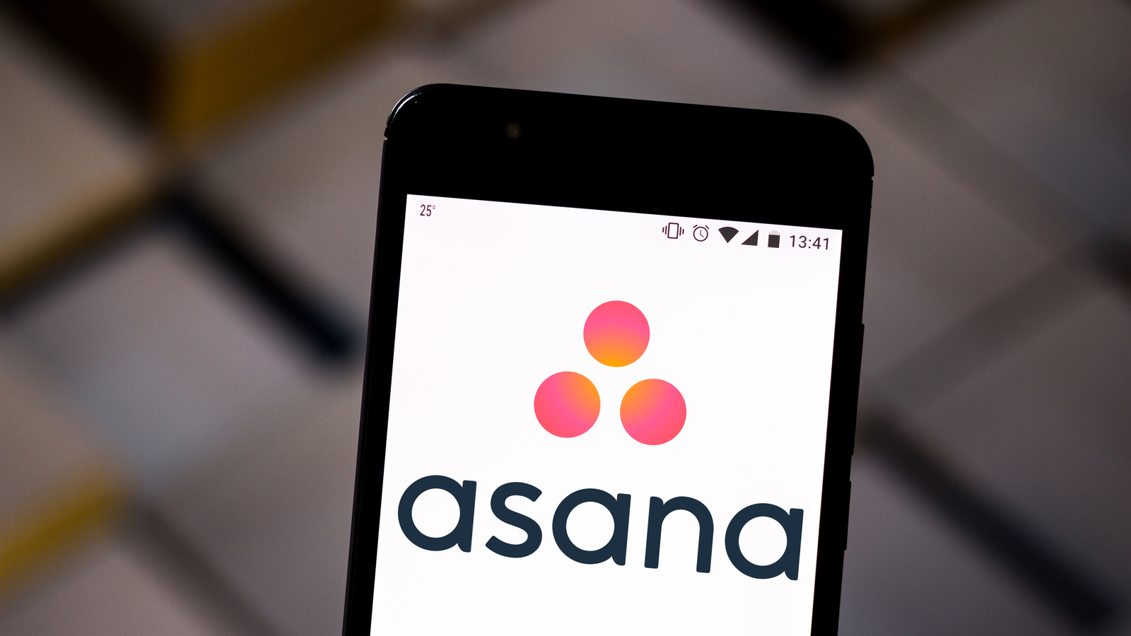 Asana logo displayed on a cellphone