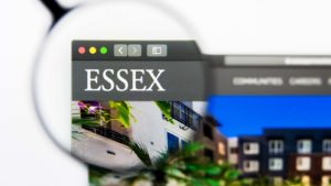 A magnifying glass zooms in on Essex Property Trust, Inc. (ESS) logo