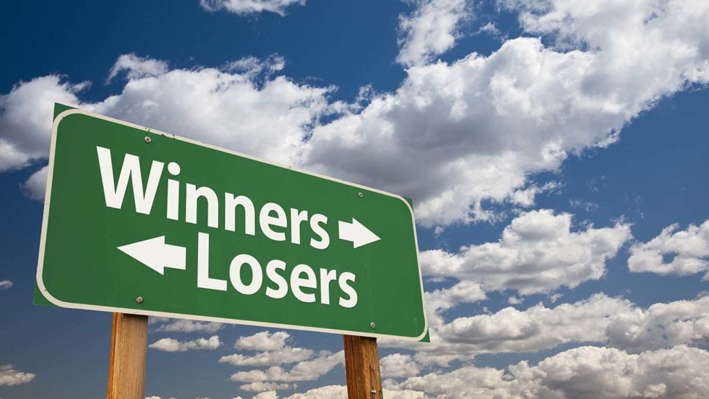 a road sign with the words winners and losers on it