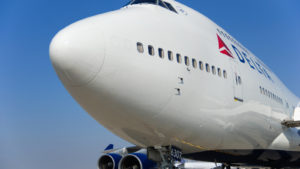 Image of an airplane branded with the Delta Airlines (DAL) logo. Represents airline stocks.