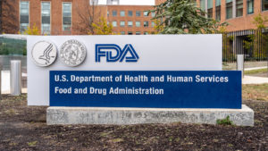 An FDA sign outside of a building representing PTGX Stock news today.