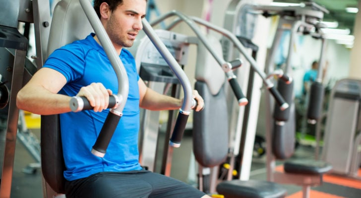 Image of a young man training in the gym
