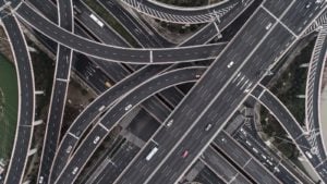 A series of roads and overpasses connect in an aerial view.