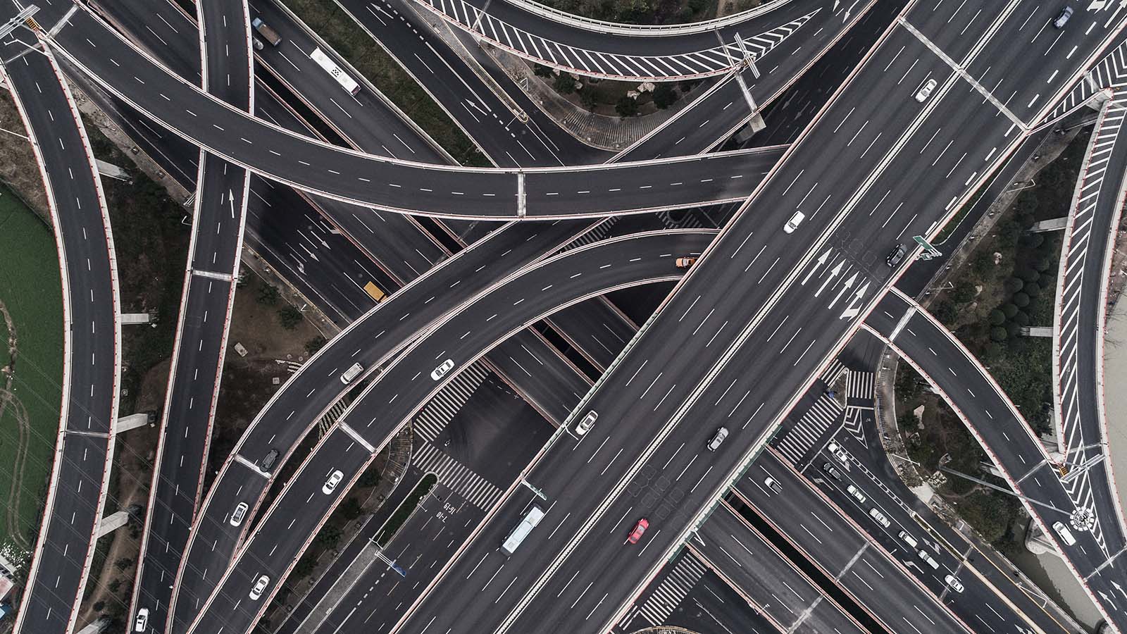 A series of roads and overpasses connect in an aerial view. best infrastructure stocks