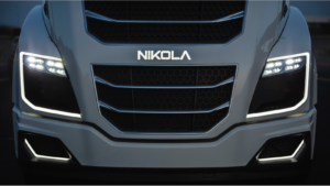 Nikola (NKLA Stock) badge on the front of a matte black car